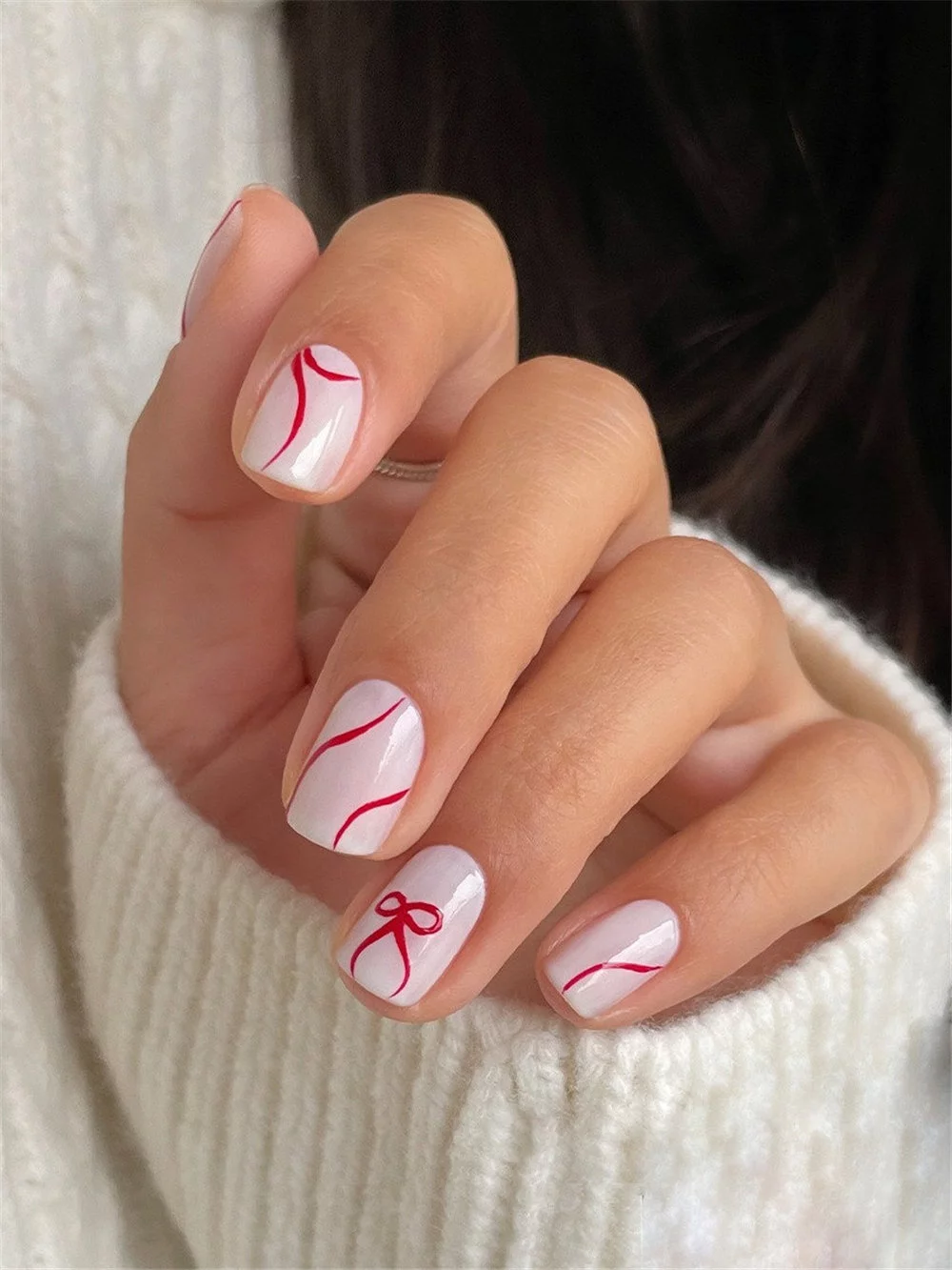 Elevate your holiday look with these 16 cute bow nails for Christmas! This year, cute bow nails are taking over the holiday trends, becoming the must-have look for winter. #ChristmasNails #BowNails #HolidayManicure #WinterNails