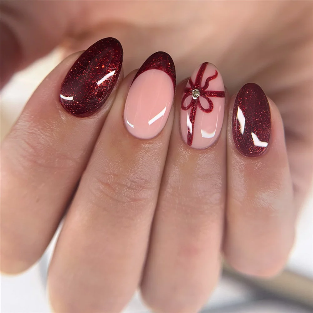 Elevate your holiday look with these 16 cute bow nails for Christmas! This year, cute bow nails are taking over the holiday trends, becoming the must-have look for winter. #ChristmasNails #BowNails #HolidayManicure #WinterNails