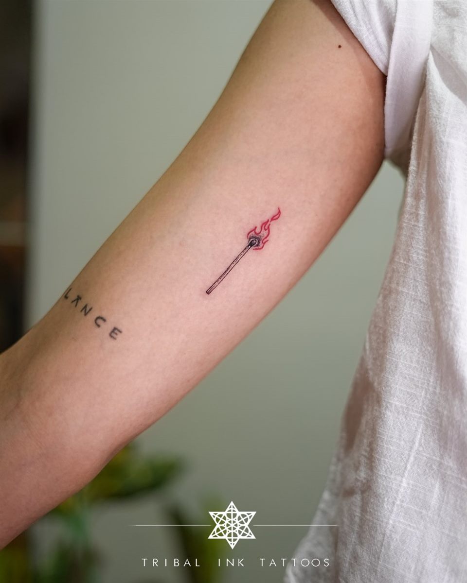 tiny red detail arm tattoo idea for summer