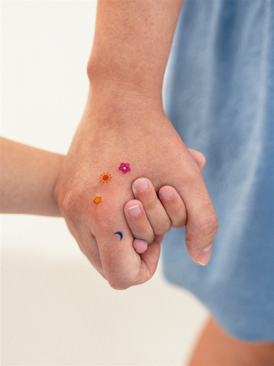 colorful small finger tattoo accent for summer
