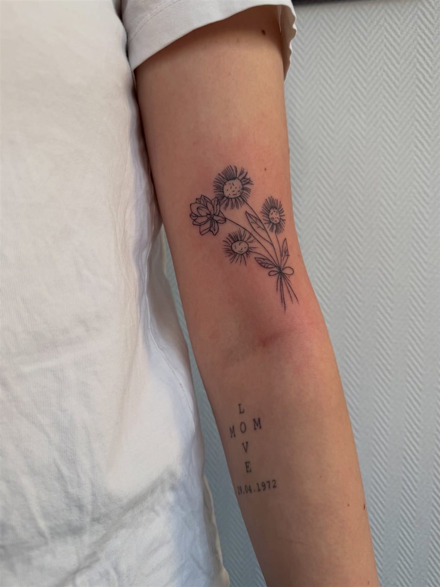 small floral forearm tattoo for women