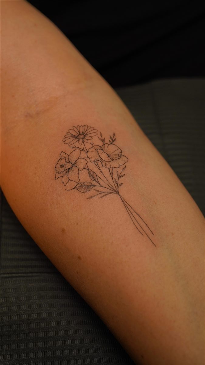 fine line flower bouquet tattoo idea
