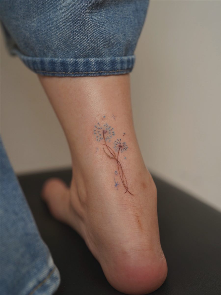 fine line ankle flower tattoo idea