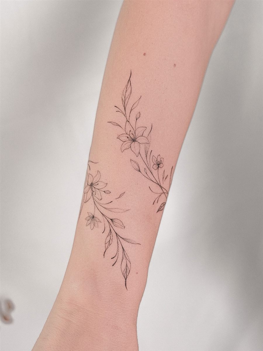 fine line botanical arm tattoo idea for summer
