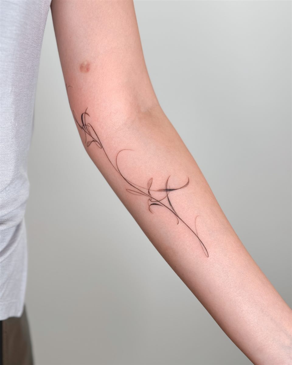 abstract fine line forearm tattoo for women
