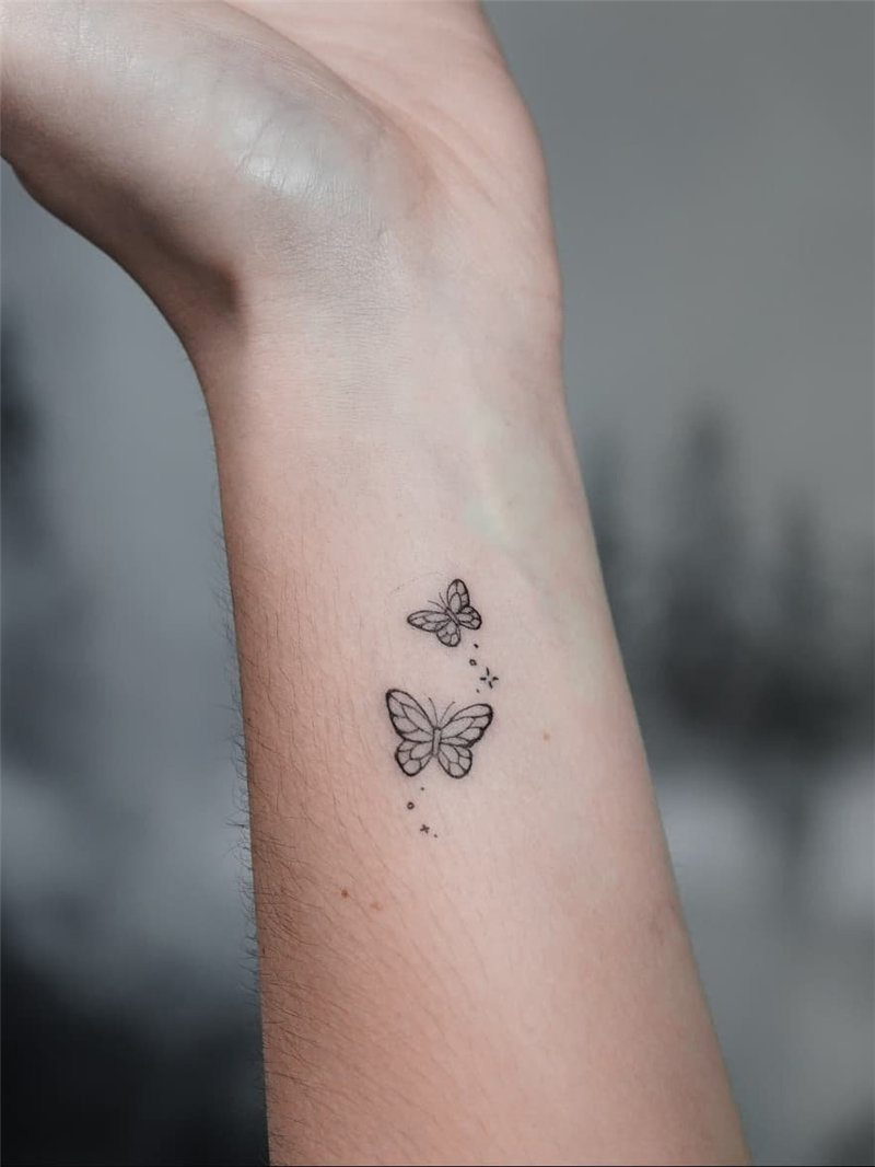 Woman with flowers and butterfly tattoo by BabiRamos on DeviantArt